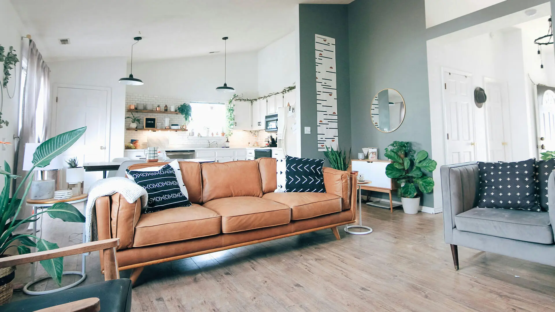 Modern living room with vaulted ceiling and leather couch